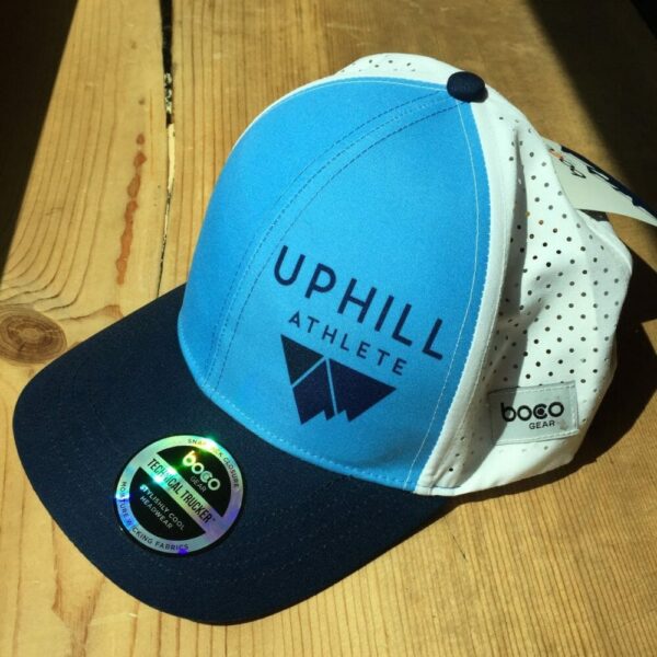 Uphill athlete running trucker hat