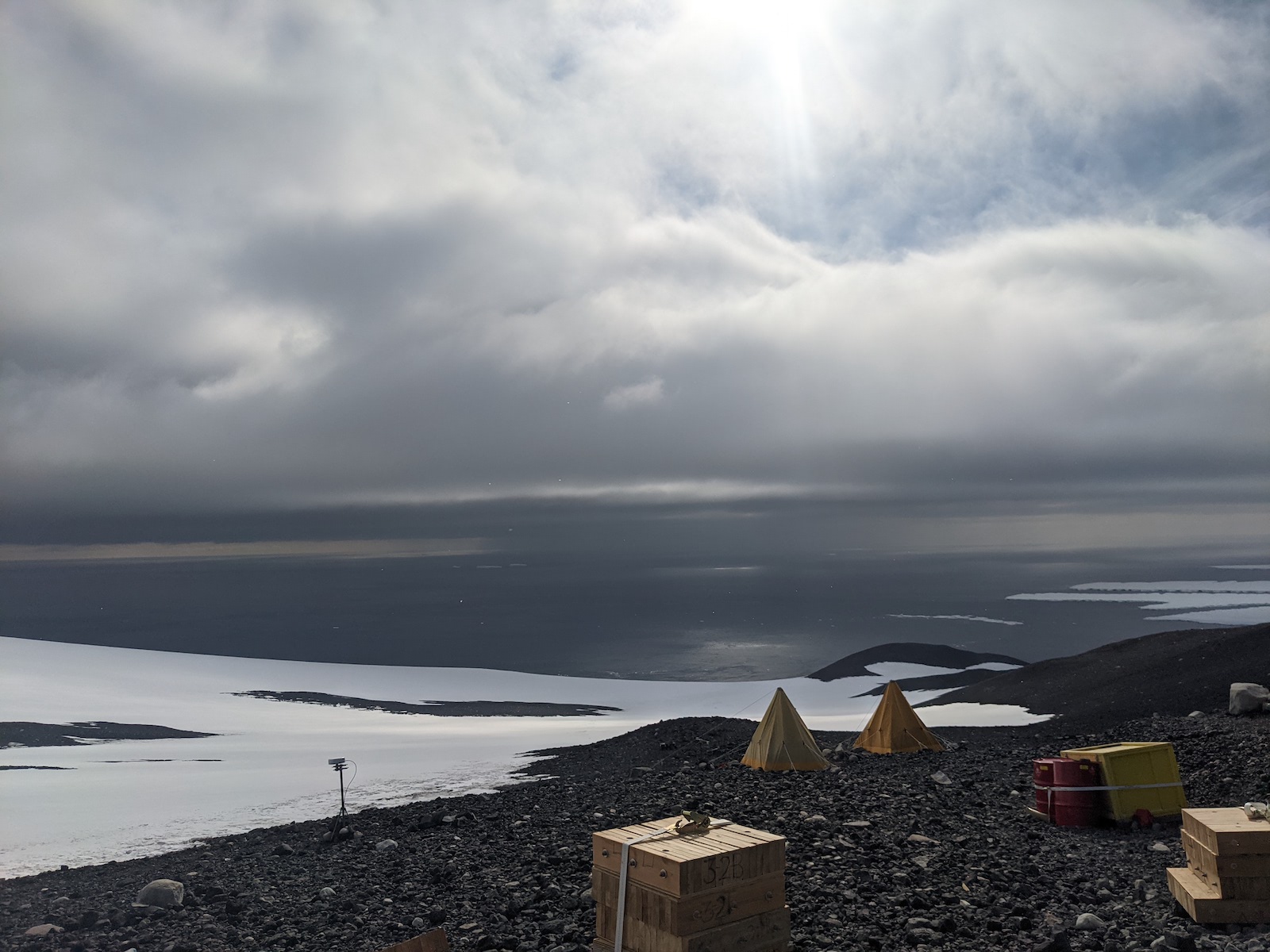 Cape Crozier, sleeping in Scott tents, with the ocean and Ross Ice Shelf in the background.