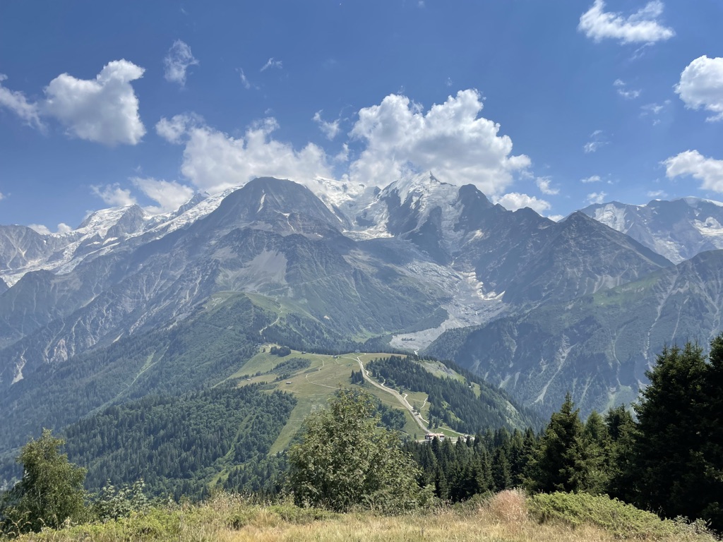 Cresting the first climb, Col de Voza, I was overwhelmed by the massive panoramic view of Mont Blanc and the Bionnassay glacier, thick crowds lining the course, swinging cowbells, and helicopters buzzing overhead.