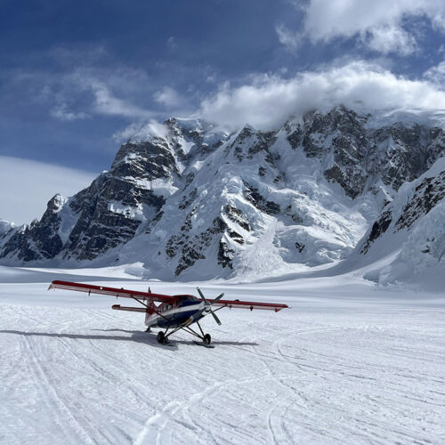 A Sheldon Air Service airplane, just big enough to hold the pilot, two climbers, and their gear. Mount Hunter is visible in the background. Says Ishidera of the allure of massive, frigid mountains like Hunter and Denali, “My personality and endurance do well with type-two fun; I’m a glass-half-full person most of the time.”